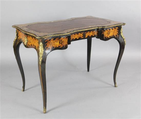 A Victorian marquetry, walnut and ebony serpentine writing table, W.3ft 5in. D.2ft H.2ft 5in.